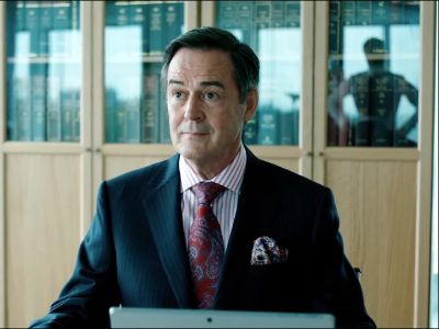 Paul Anthony-Barber is on a suit and a tie as he has a laptop in front of him in the picture.